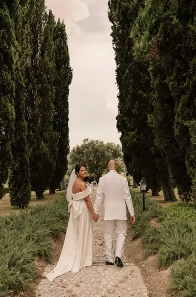 Couple walking down the cypress lane