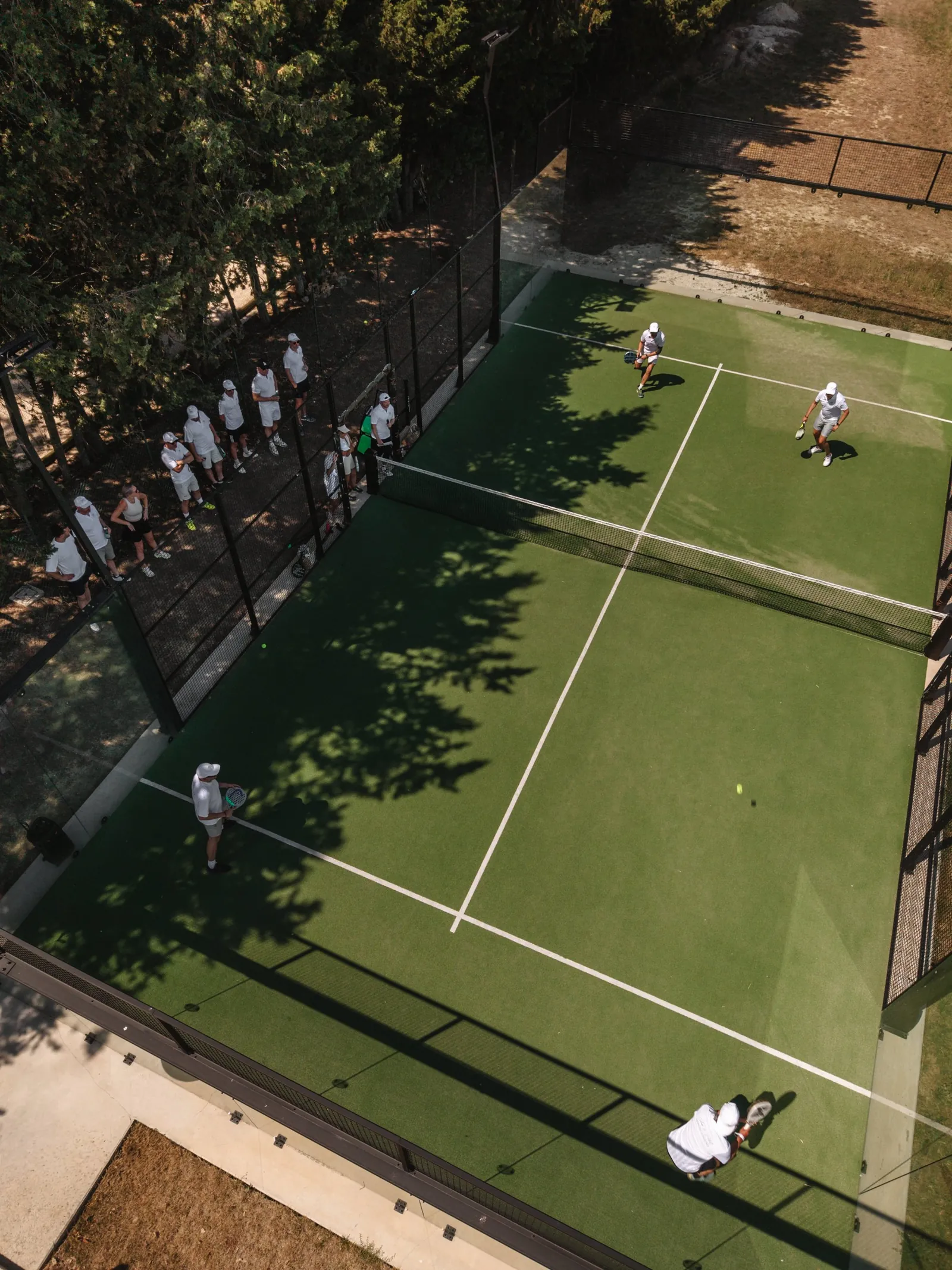 Padel tournament with guests watching from the side